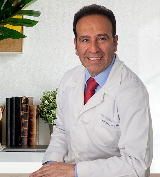 Handsome smiling medicine doctor sitting in office